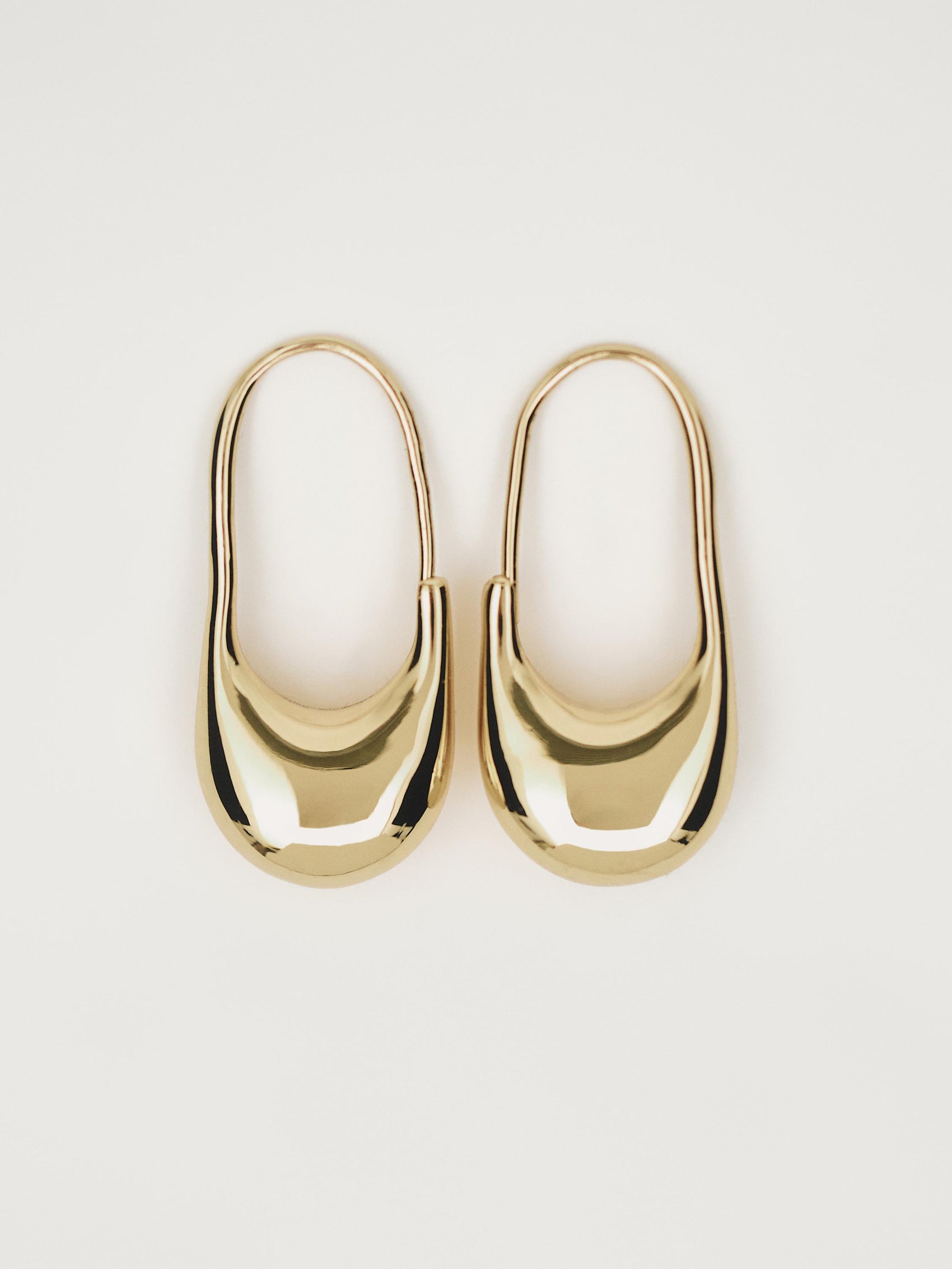 Gold toned padlock hoop earrings